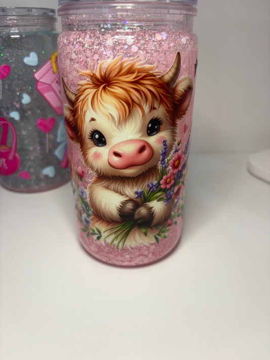 Pink glitter 16oz snow globe tumbler with floral Highland cow design
